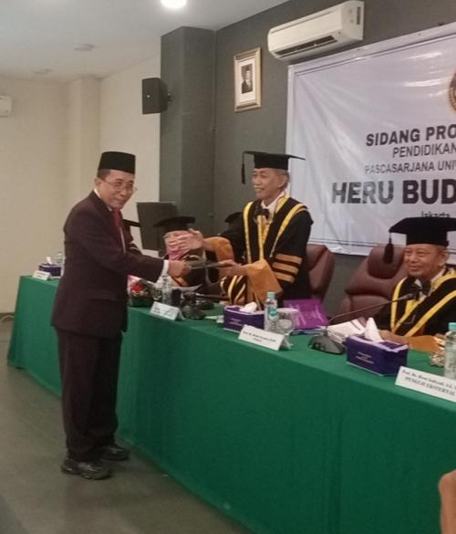 Diuji 6 Profesor, Heru Budi Santoso Raih Gelar Doktor Dengan Nilai Cumlaude